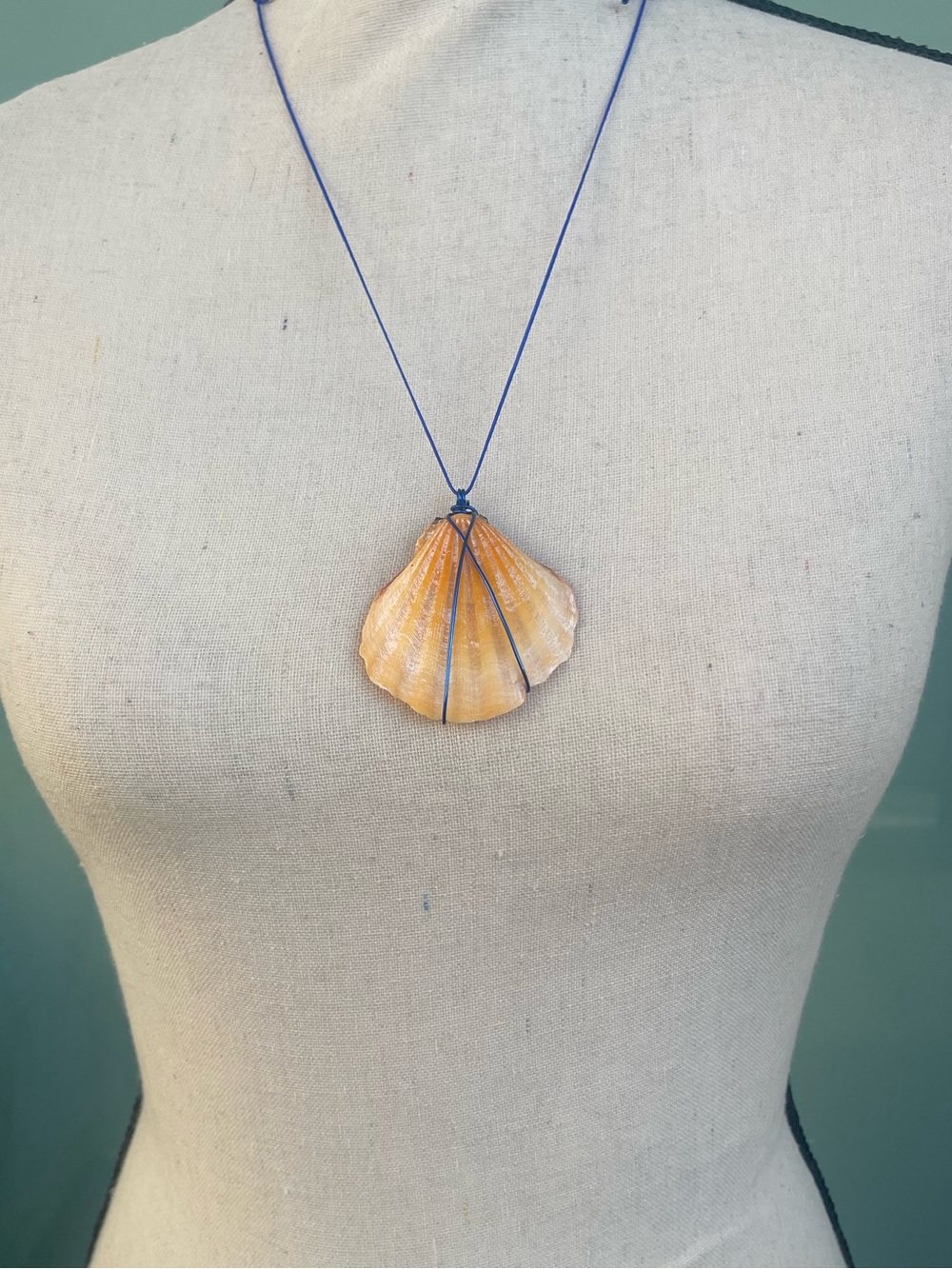 Orange Shell Wire Wrapped Necklace on a Blue Nylon Cord